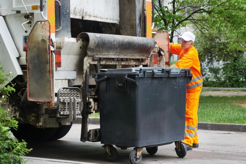 Crew loading a van to calculate cubic-yard rates for rubbish removal