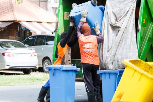 Technicians removing items from a loft